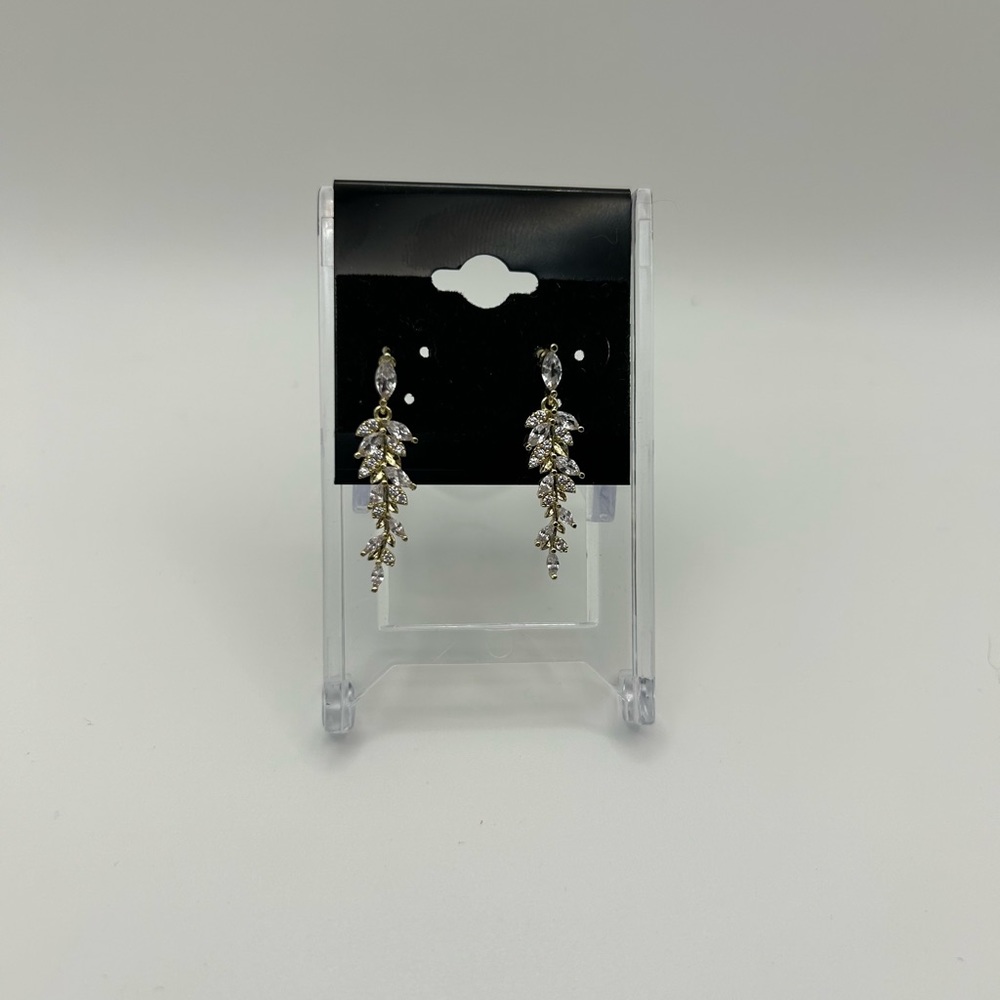 3/10$ gold toned fern like earrings